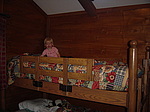 Elizabeth having fun on Josiah's bunk at our cabin at Fort Wilderness